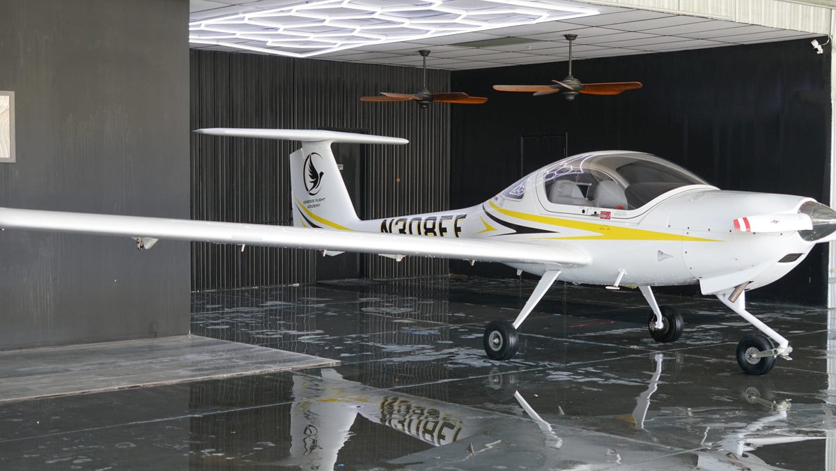 Teen student pilot with instructor at a Diamond trainer — Van Nuys Airport